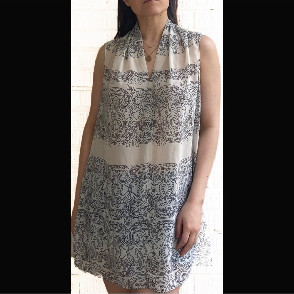 Woman’s size L CAbi high-low tank blouse. PERFECT CONDITION! ORIGINALLY $89